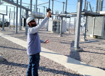 OPD5 Substation Technician Jared Klunker uses infrared camera equipment to check for hotspots and potential problems at a substation inspection earlier this month. 